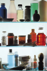 Medicine bottles on shelves in medicine cabinet