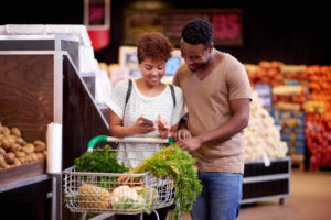 young African American couple buying groceries